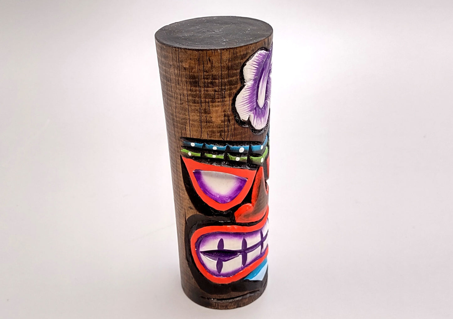 Painted Wooden Tiki Totem Purple And Red (1 pole approx. 6 inches tall) A fun unique touch of colorful Island table décor!