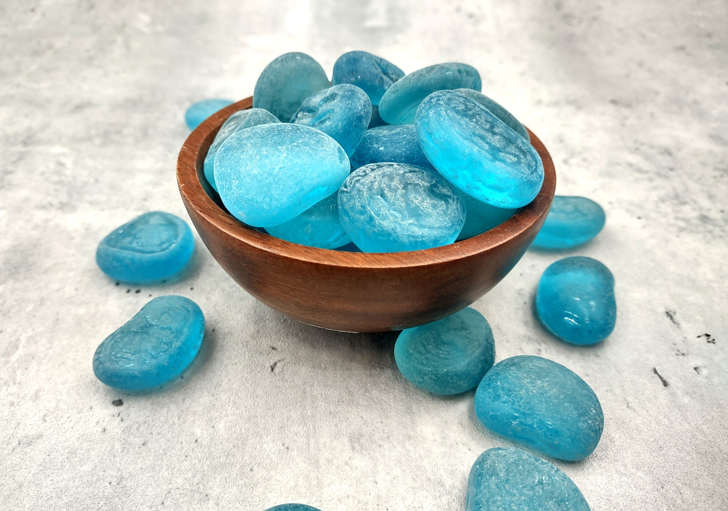 Beach Sea Glass Rounded Turquoise Blue Frosted Tumbled Pebbles (approx. 1 Kilogram or 2.2 lbs. 1-1.5 inch). Pile of blue turquoise Beach Glass pebbles. Copyright 2024 SeaShellSupply.com.