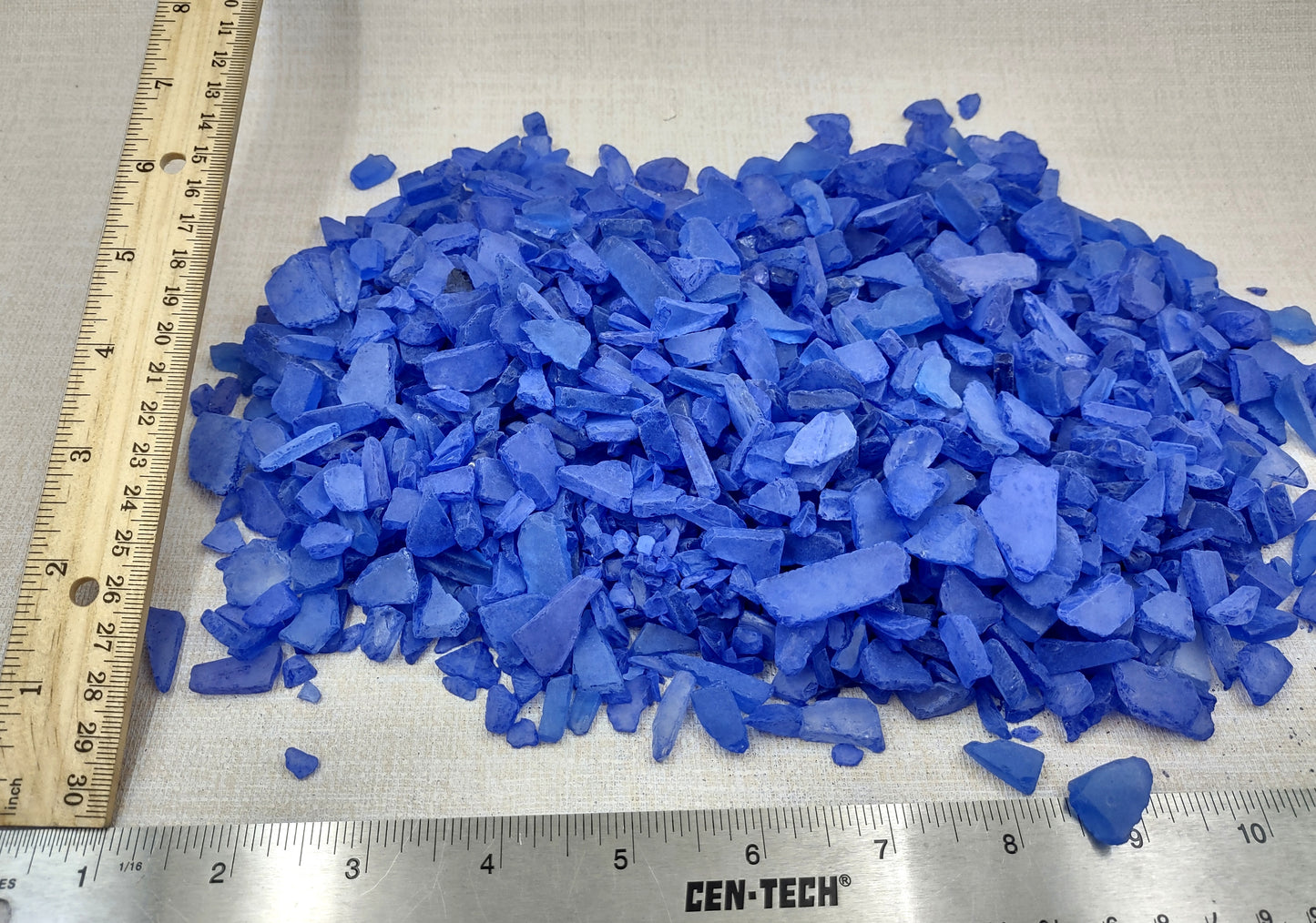 Beach Sea Glass Rough Deep Blue Medium Tumbled (approx. 1 kilogram 0.5-1+ inches) Man made tumbled sea glass! Ombre blue chips, perfect for vase decorating and mosaic tile making. Copyright 2024 SeaShellSupply.com