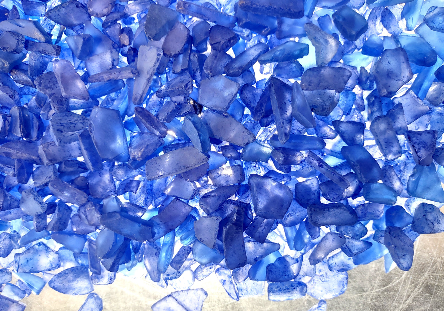 Beach Sea Glass Rough Deep Blue Medium Tumbled (approx. 1 kilogram 0.5-1+ inches) Man made tumbled sea glass! Ombre blue chips, perfect for vase decorating and mosaic tile making. Copyright 2024 SeaShellSupply.com