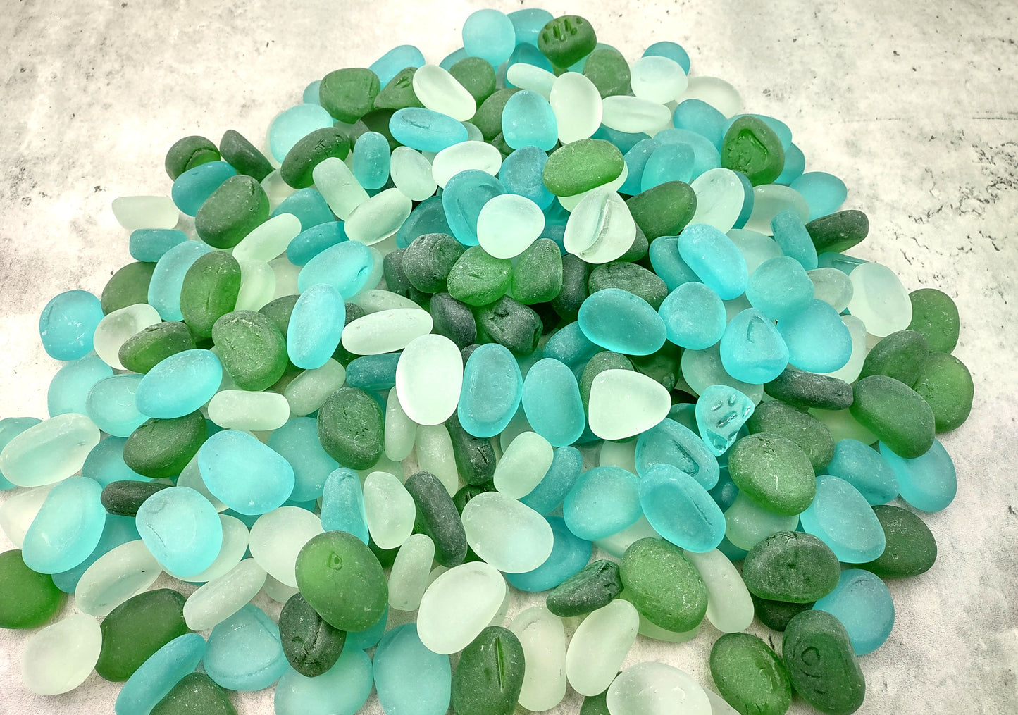 Beach Sea Glass Rounded White Blue Green Assorted Tumbled Pebbles (approx. 10 pounds 1+ inch) Copyright 2024 SeaglassSupply.com