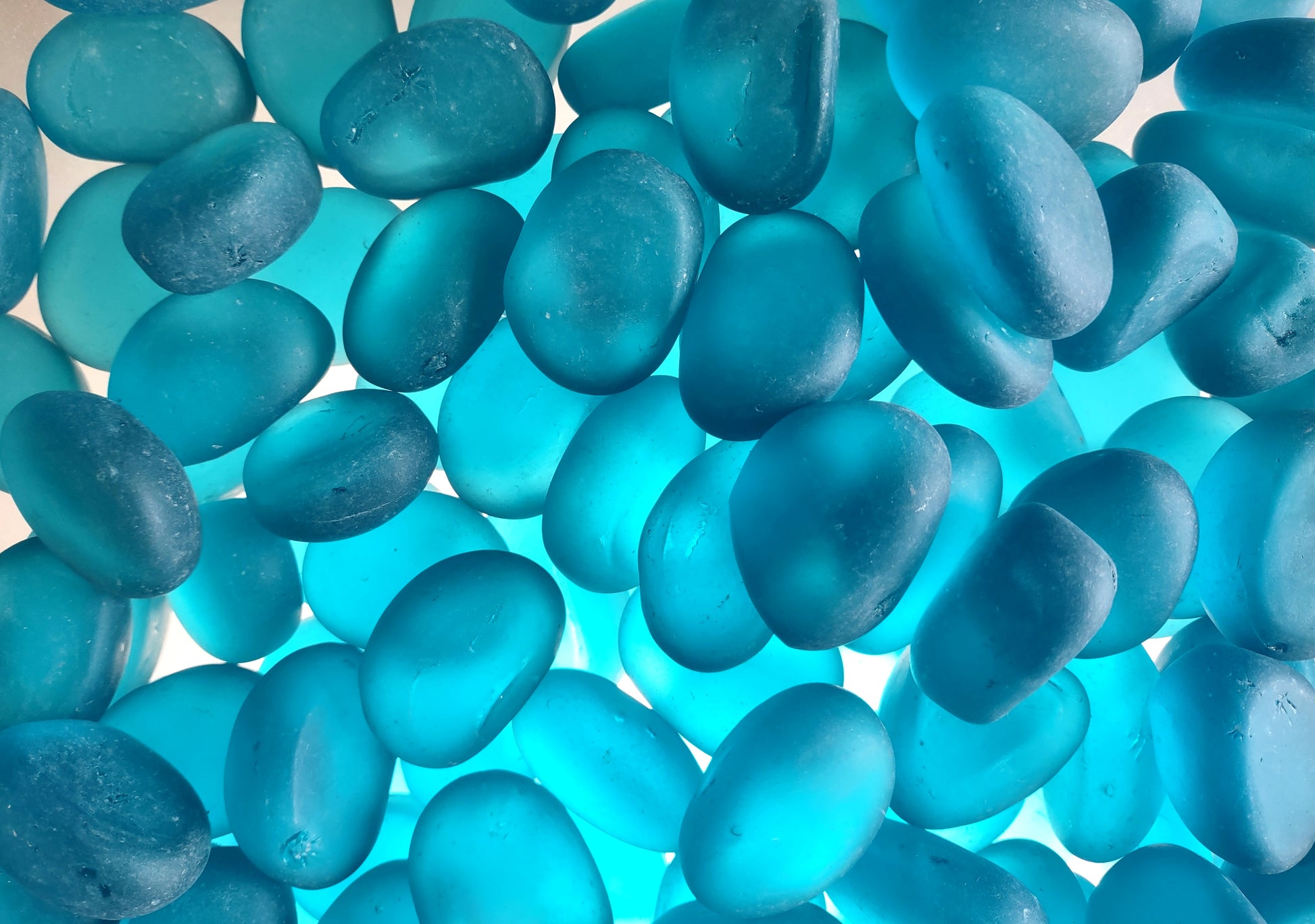 Beach Sea Glass Rounded Turquoise Blue Frosted Tumbled Pebbles (approx. 1 Kilogram or 2.2 lbs. 1-1.5 inch). Pile of blue turquoise Beach Glass pebbles. Copyright 2024 SeaShellSupply.com.