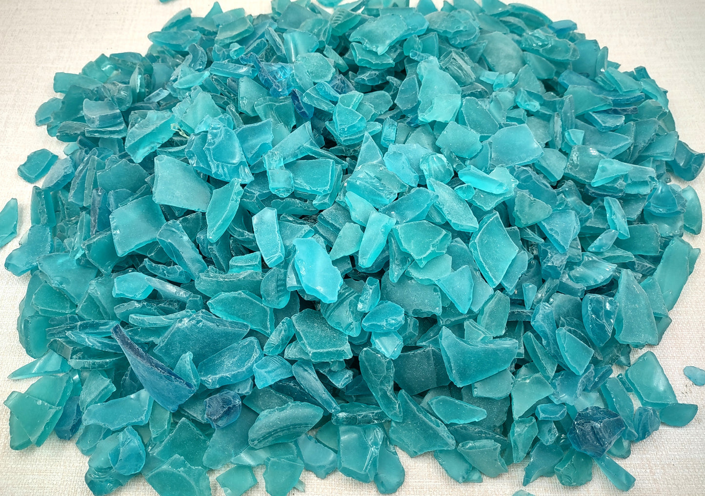 Beach Sea Glass Rough Ocean Blue Medium Tumbled (approx. 10 pounds 0.5-1+ inches Man made tumbled rough sea glass fragments. Copyright 2024 SeashellSupply.com