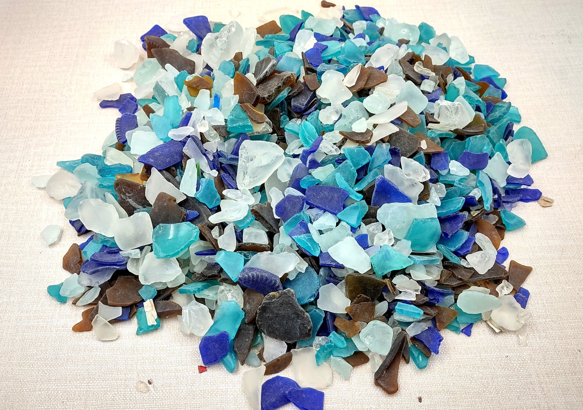 Beach Sea Glass Rough Pacific Mix Medium Tumbled (approx. 10 pounds 0.5-1+ inches) Man made tumbled rough sea glass fragments. Copyright 2024 seashellsupply.com