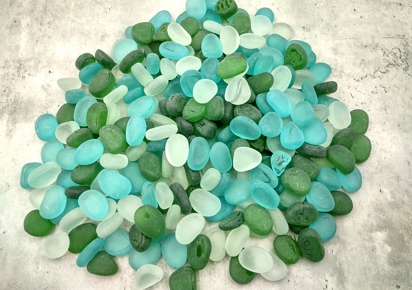 Beach Sea Glass Rounded White Blue Green Assorted Tumbled Pebbles (approx. 10 pounds 1+ inch) Copyright 2024 SeaglassSupply.com