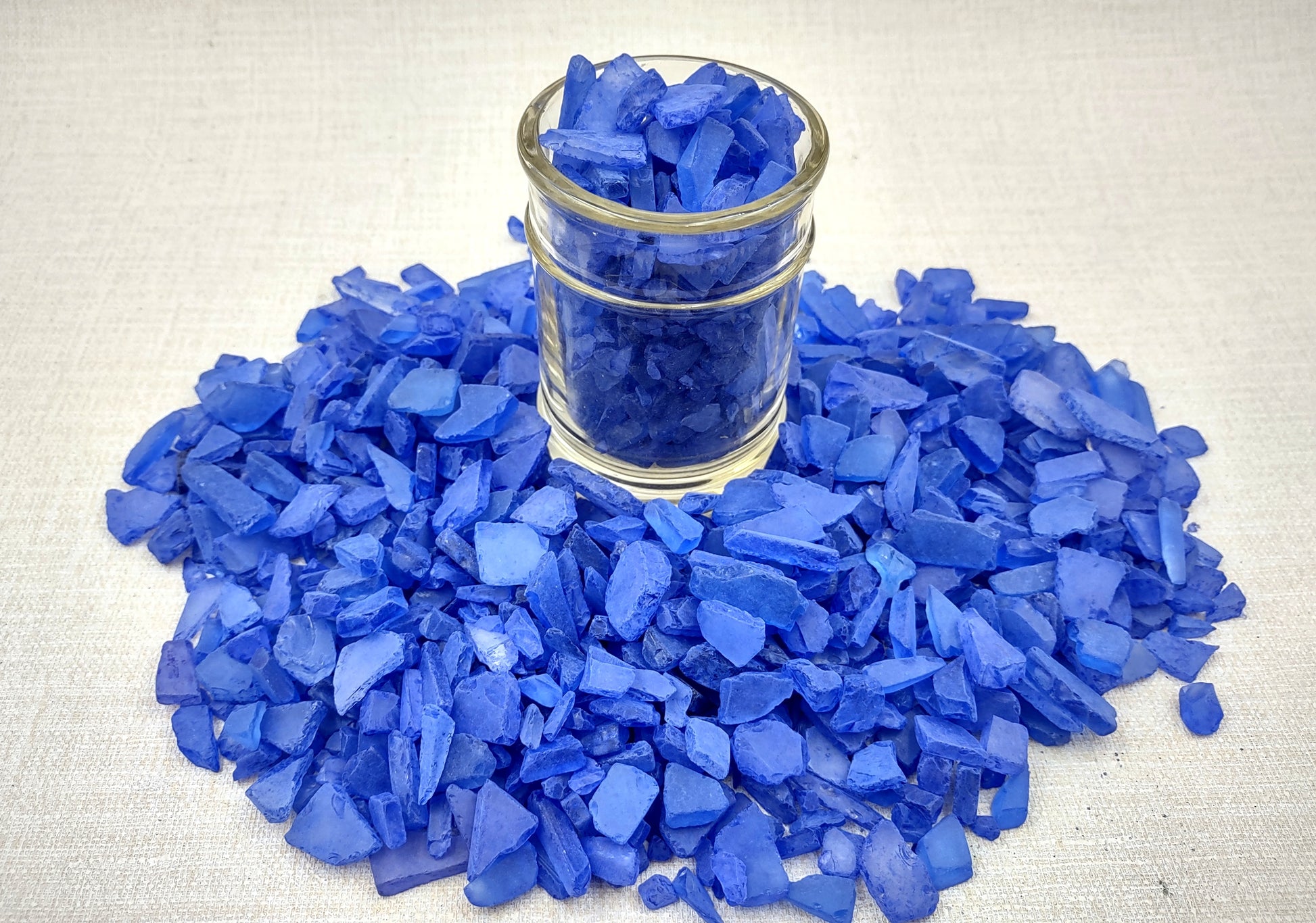 Beach Sea Glass Rough Deep Blue Medium Tumbled (approx. 1 kilogram 0.5-1+ inches) Man made tumbled sea glass! Ombre blue chips, perfect for vase decorating and mosaic tile making. Copyright 2024 SeaShellSupply.com