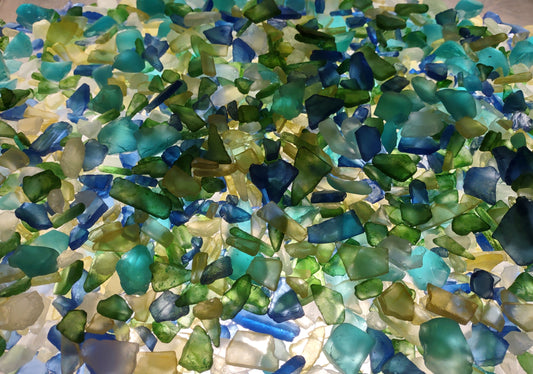 Beach Glass - Medium Tumbled Rough Blue, Green & White Atlantic Assorted - (approx. 1 Kilogram/2.2 lbs. .5-1.25 inches). Multiple different shapes and sizes pieces all in a pile. Copyright 2024 SeaShellMart.com.