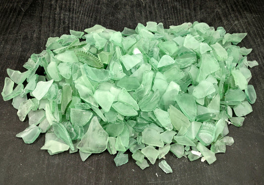 Beach Glass - Medium Tumbled Rough Coke Bottle Green - (approx. 1 Kilogram/2.2 lbs. .5-1.25 inches). Multiple green glass pieces in different shapes. Copyright 2024 SeaShellSupply.com.