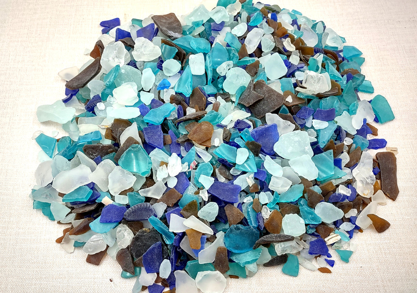 Beach Sea Glass Rough Pacific Mix Medium Tumbled (approx. 10 pounds 0.5-1+ inches) Man made tumbled rough sea glass fragments. Copyright 2024 seashellsupply.com