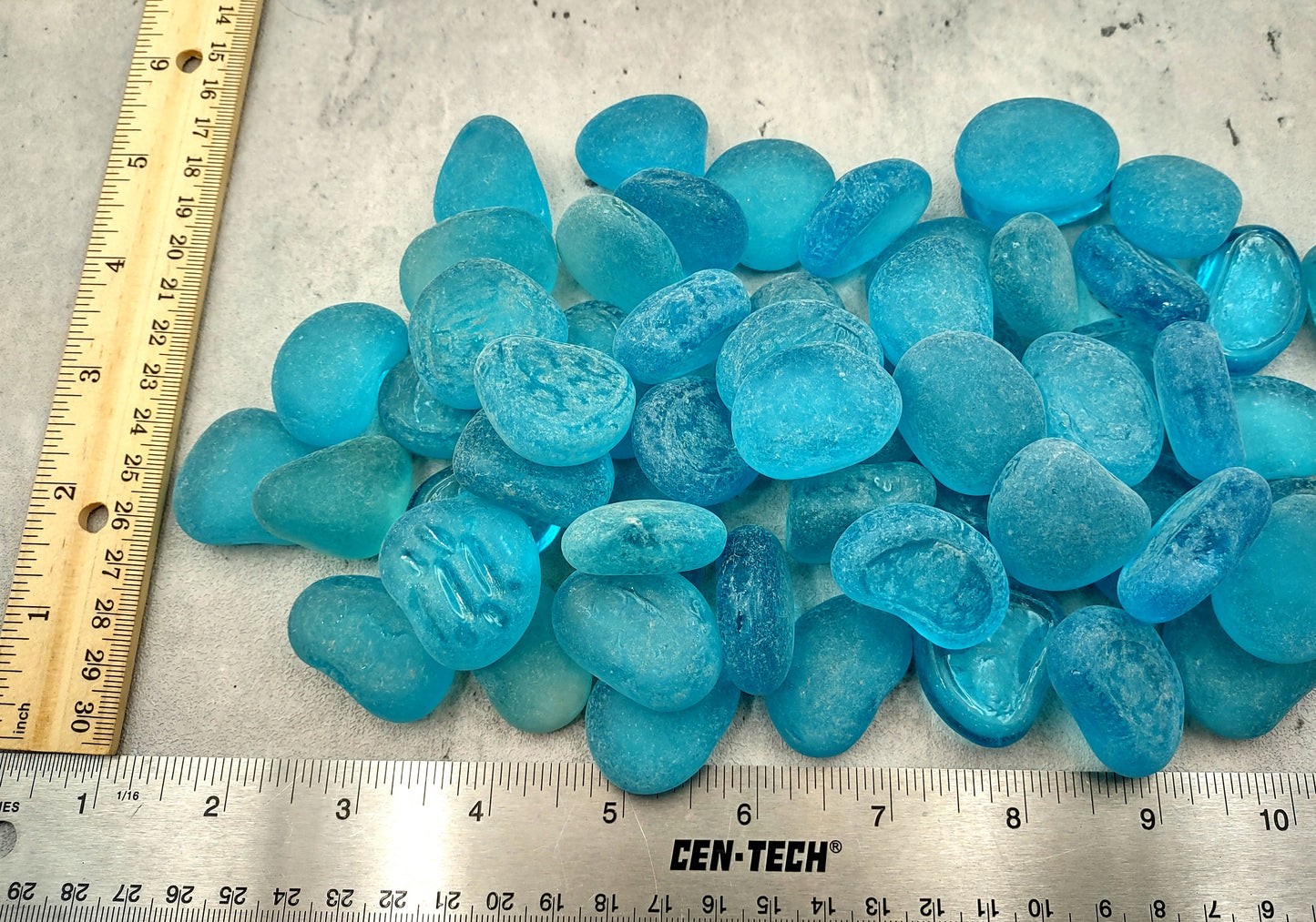 Beach Sea Glass Rounded Turquoise Blue Frosted Tumbled Pebbles (approx. 1 Kilogram or 2.2 lbs. 1-1.5 inch). Pile of blue turquoise Beach Glass pebbles. Copyright 2024 SeaShellSupply.com.