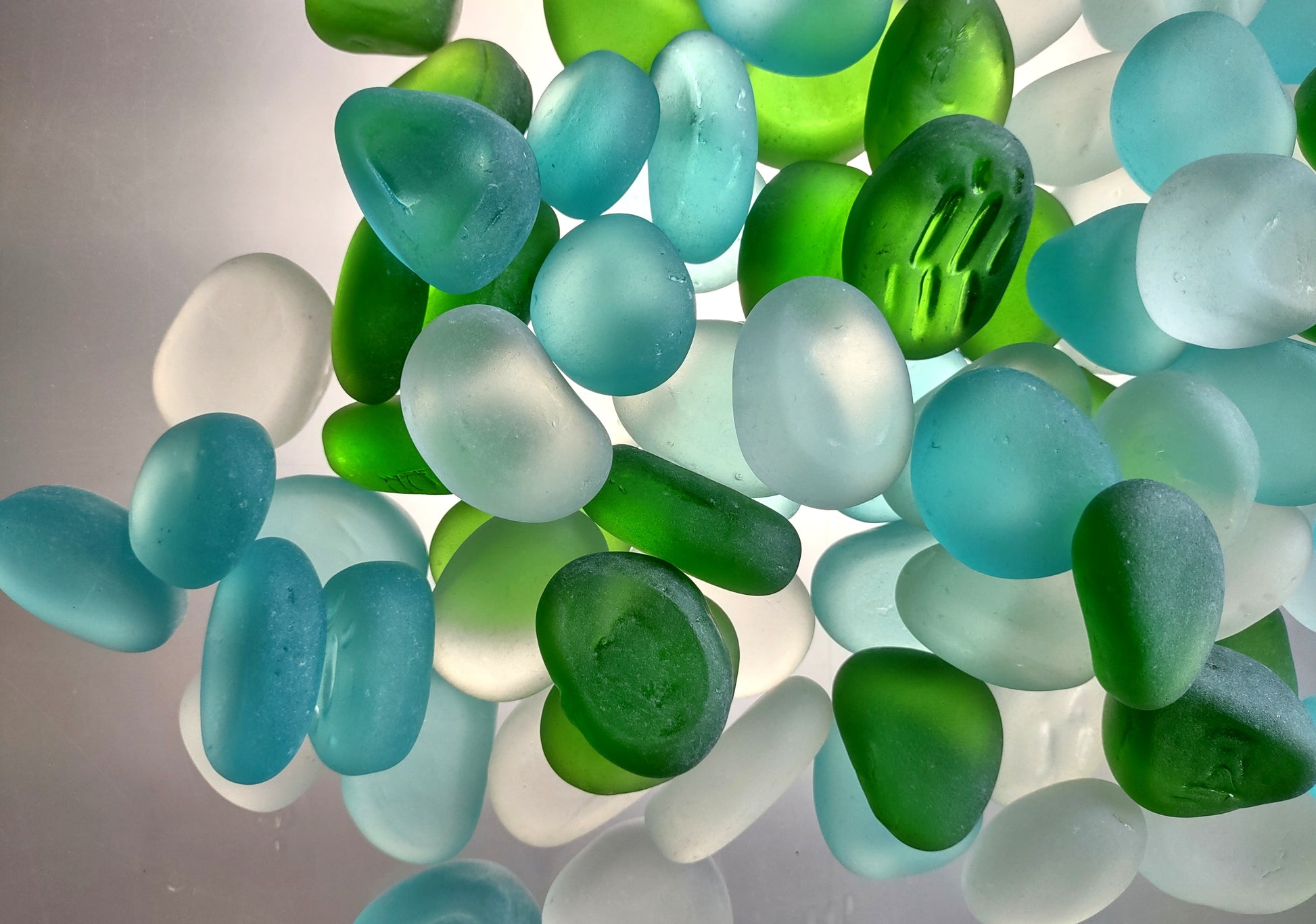 Beach Sea Glass Rounded White Blue Green Assorted Tumbled Pebbles (approx. 10 pounds 1+ inch) Copyright 2024 SeaglassSupply.com