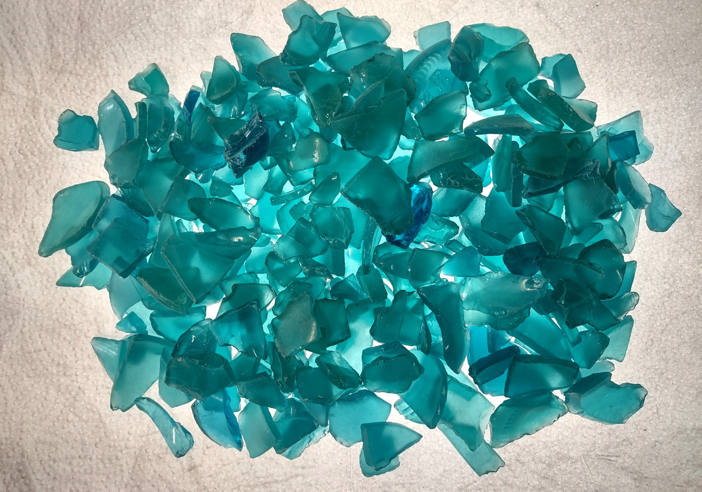 Beach Sea Glass Rough Ocean Blue Frosted (approx. 1 kilogram 0.5-1+ inches) Man made tumbled frosted sea glass fragments. Copyright 2024 Seashellsupply.com