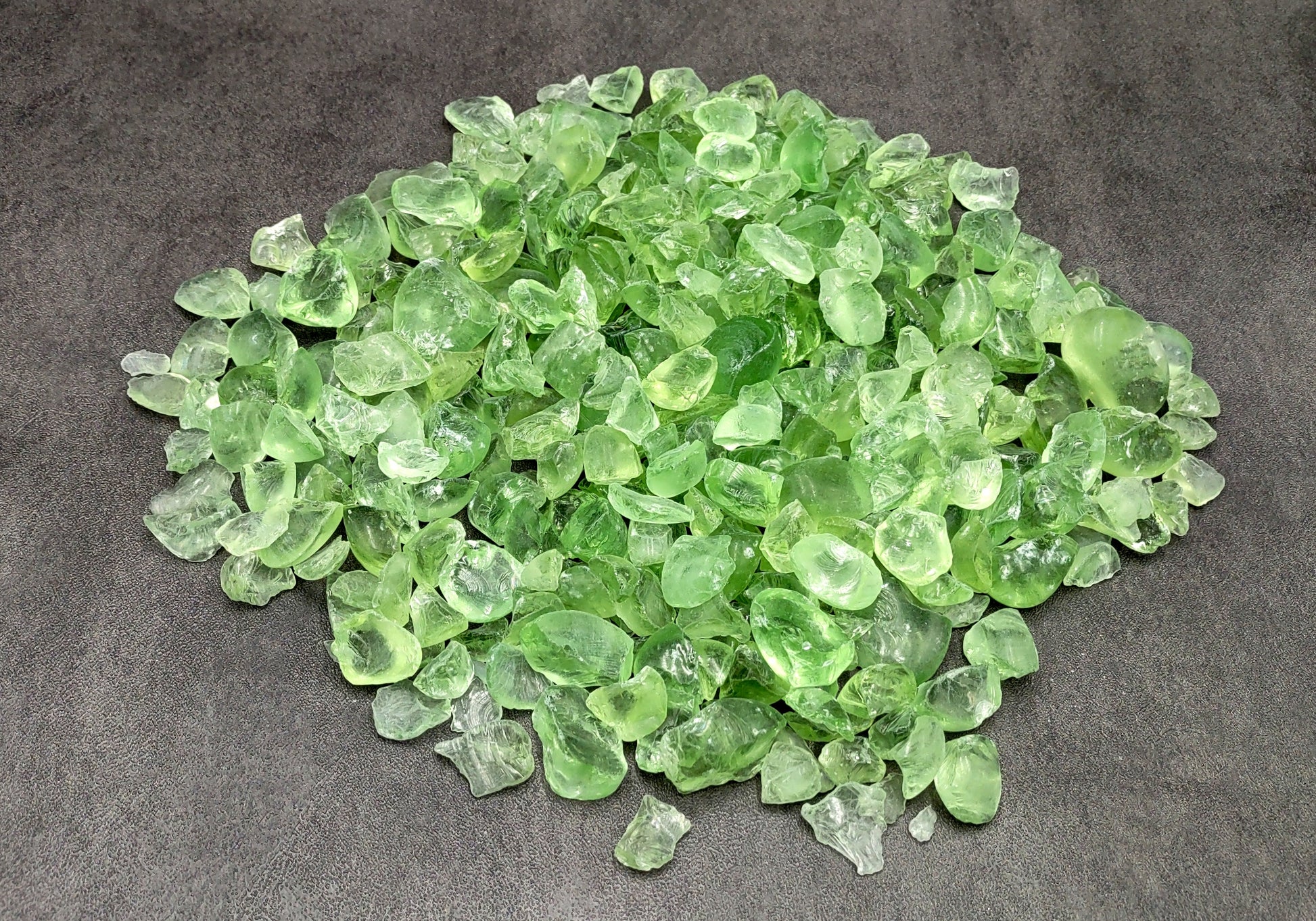 Beach Glass - Crushed & Tumbled Small Light Green Pebbles - (approx. 1 Kilogram/2.2 lbs. .25-1 inches). Multiple different colored crushed pebbles in a pile. Copyright 2022 SeaShellSupply.com.