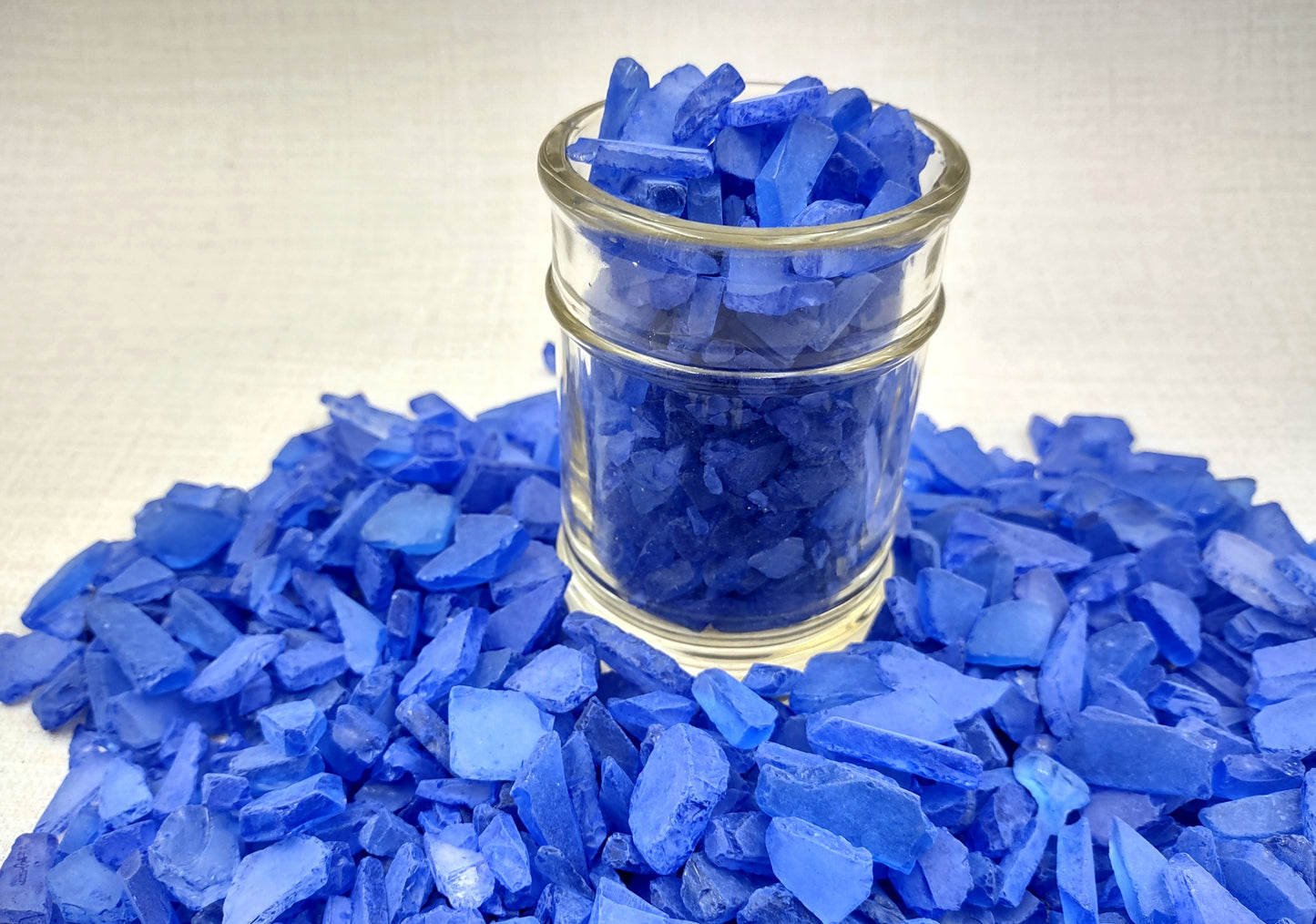 Beach Sea Glass Rough Deep Blue Medium Tumbled (approx. 1 kilogram 0.5-1+ inches) Man made tumbled sea glass! Ombre blue chips, perfect for vase decorating and mosaic tile making. Copyright 2024 SeaShellSupply.com