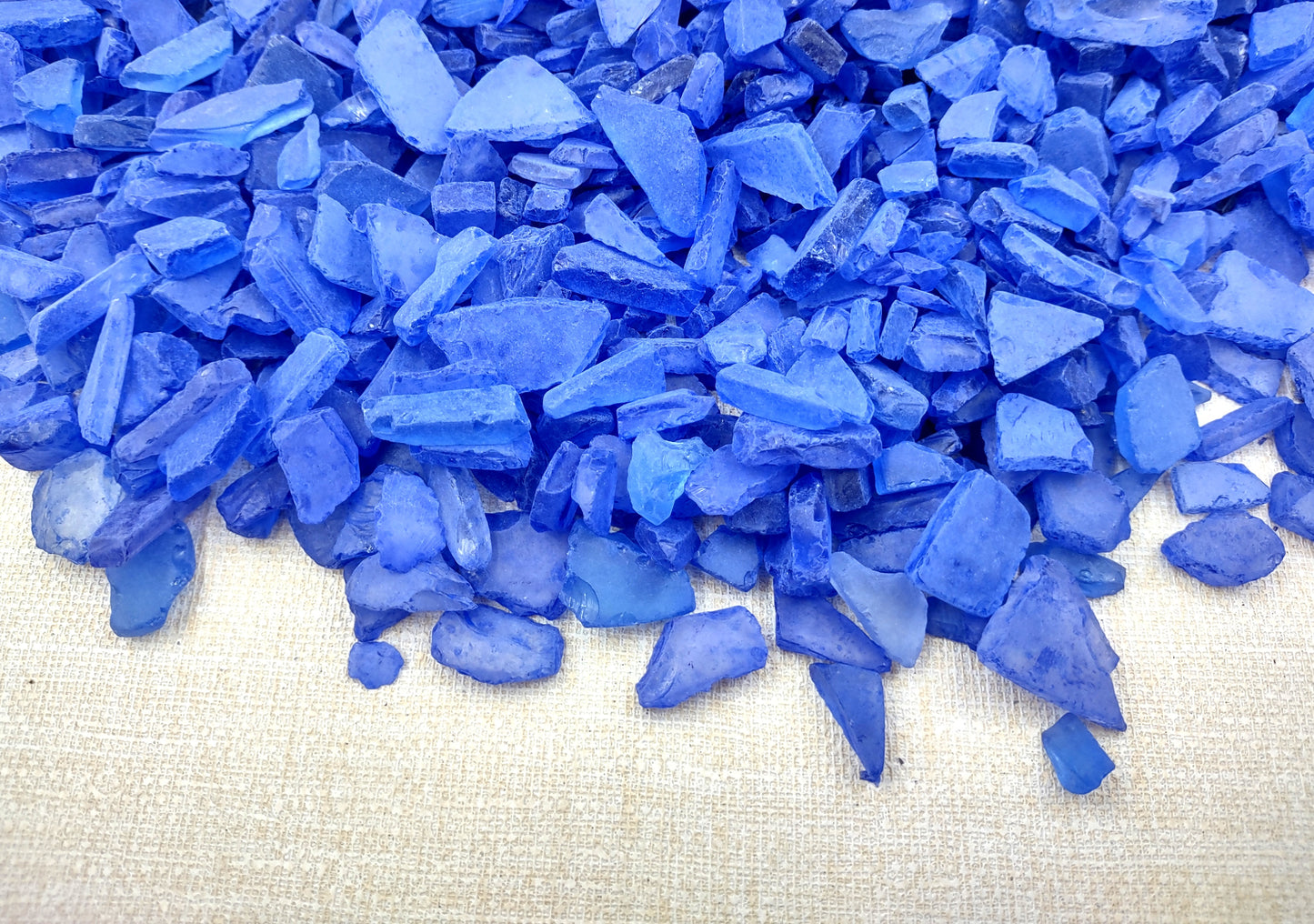 Beach Sea Glass Rough Deep Blue Medium Tumbled (approx. 1 kilogram 0.5-1+ inches) Man made tumbled sea glass! Ombre blue chips, perfect for vase decorating and mosaic tile making. Copyright 2024 SeaShellSupply.com