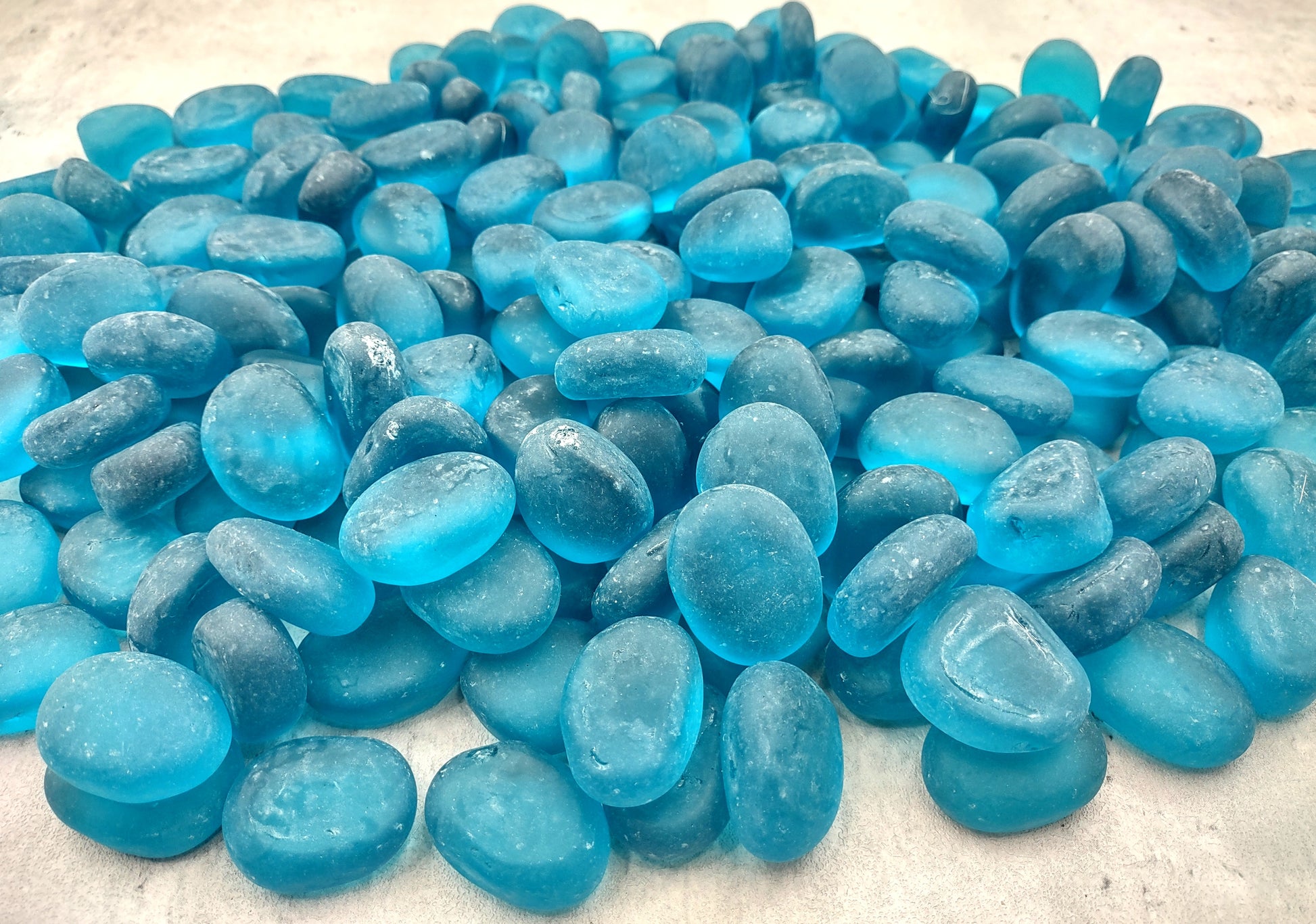 Beach Sea Glass Rounded Ocean Blue Tumbled Pebbles (approx. 10 pounds 1+ inch) Copyright 2024 SeaShellSupply.com