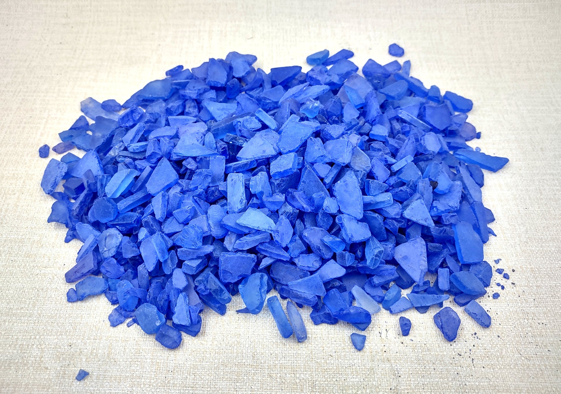 Beach Sea Glass Rough Deep Blue Medium Tumbled (approx. 1 kilogram 0.5-1+ inches) Man made tumbled sea glass! Ombre blue chips, perfect for vase decorating and mosaic tile making. Copyright 2024 SeaShellSupply.com