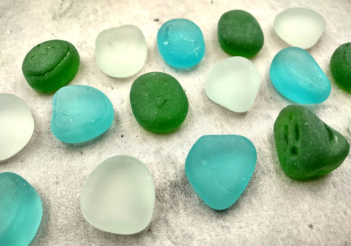 Beach Sea Glass Rounded White Blue Green Assorted Tumbled Pebbles (approx. 10 pounds 1+ inch) Copyright 2024 SeaglassSupply.com