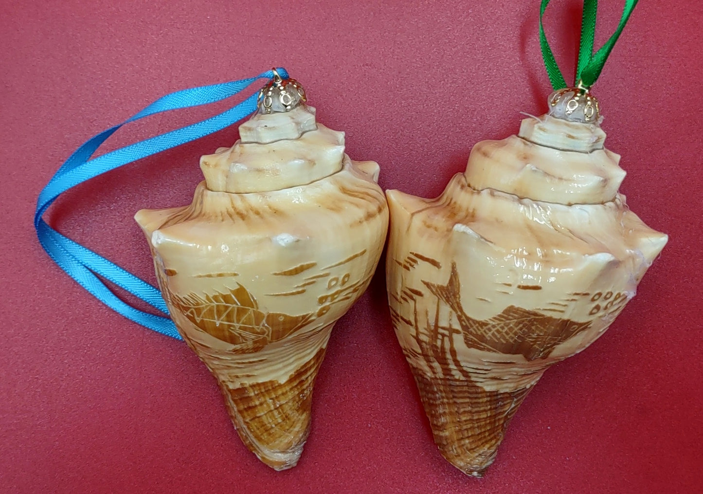 Carved Conch Seashell Ornament (2 shells approx. 2+ inches) Beautiful ornament for any gifting or adding to the holidays! Beautiful spiral shells for any beach lover! Copyright 2024 SeaShellMart.com